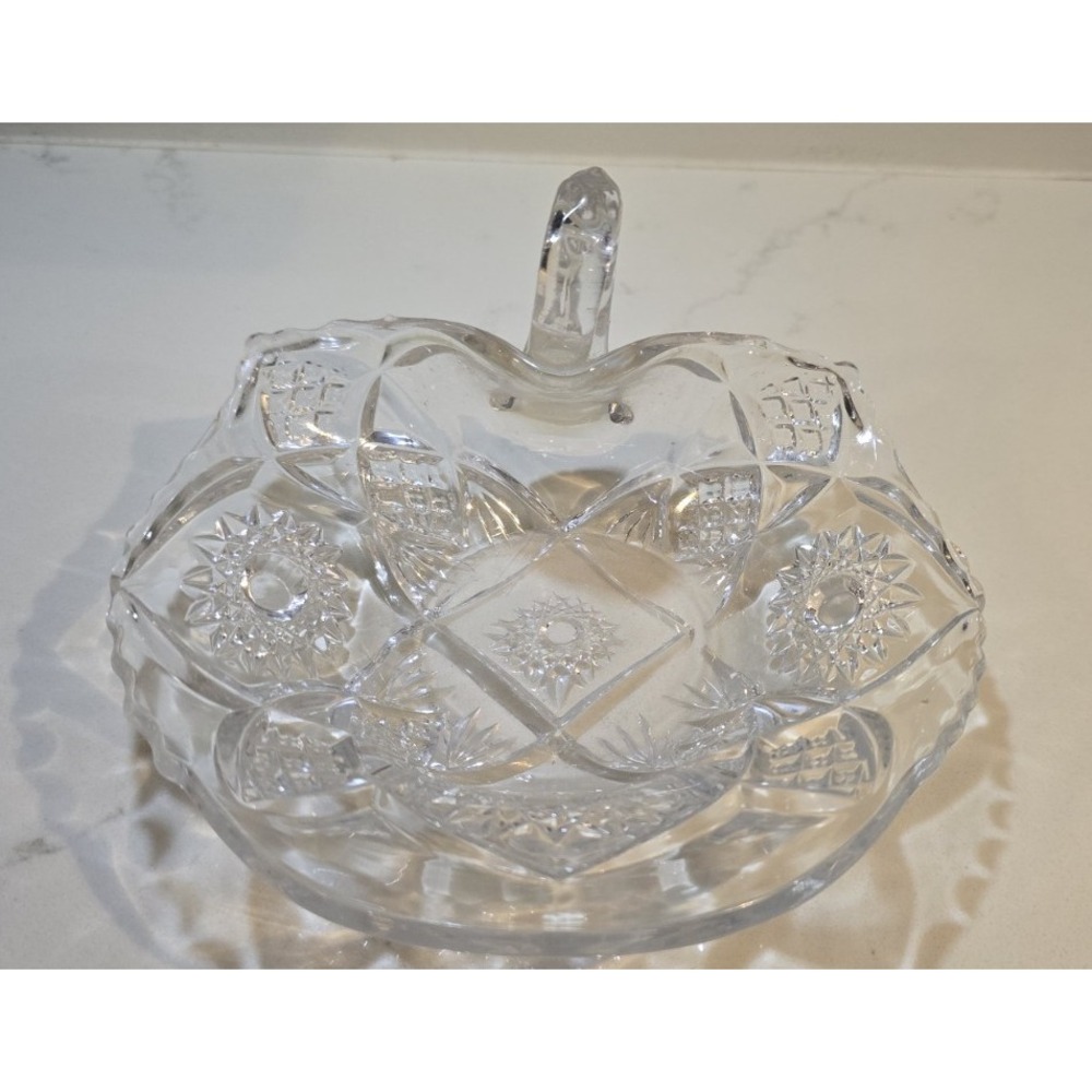 Clear glass candy or nut dish featuring the American Brilliant Cut style